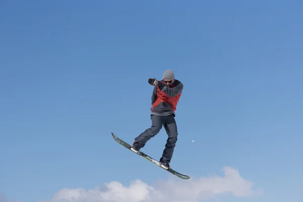 Snowboarder jumps in Snow Park — Stock Photo, Image