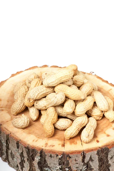 Pile of unshelled peanuts, isolated on white background — Stock Photo, Image