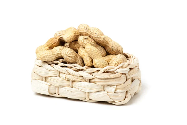 Peanuts isolated in basket on white background — Stock Photo, Image