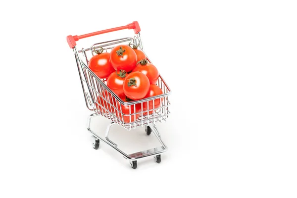トマト、白で隔離されるショッピング カート — ストック写真