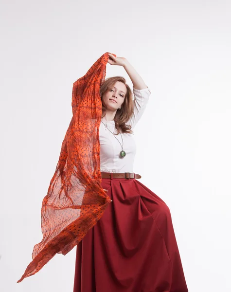 Woman in skirt dancing with a red handkerchief — Stock Photo, Image