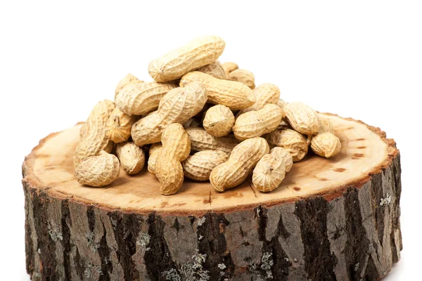 Pile of unshelled peanuts, isolated on white background — Stock Photo, Image