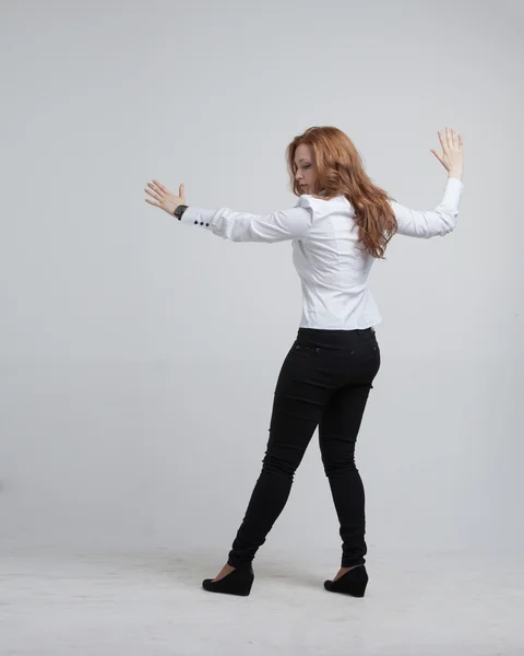 Young girl stands back and working with virtual screen — Stock Photo, Image