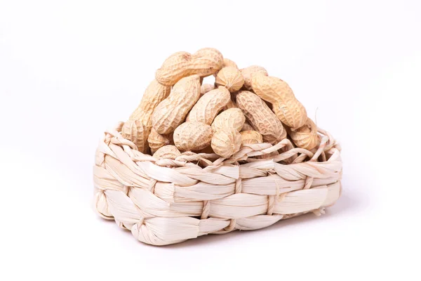Peanuts isolated in basket on white background — Stock Photo, Image