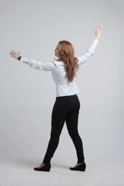 Young girl stands back and working with virtual screen — Stock Photo, Image