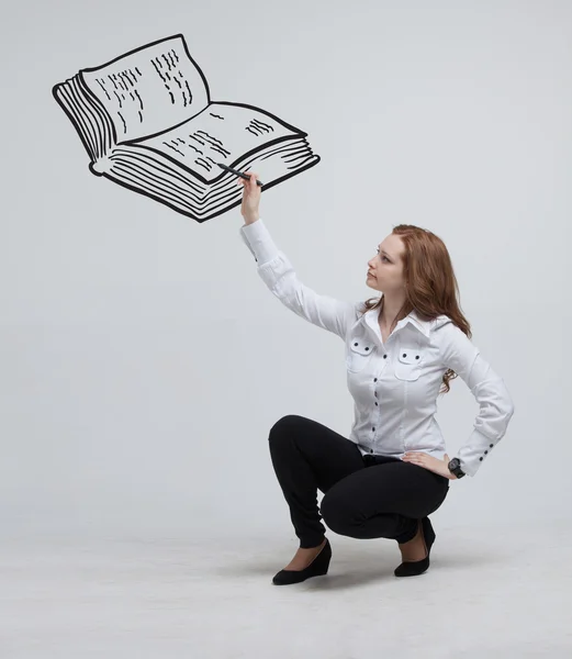 Woman drawing a book — Stock Photo, Image