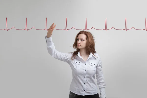 Doctor woman drawing cardiogram — Stock Photo, Image