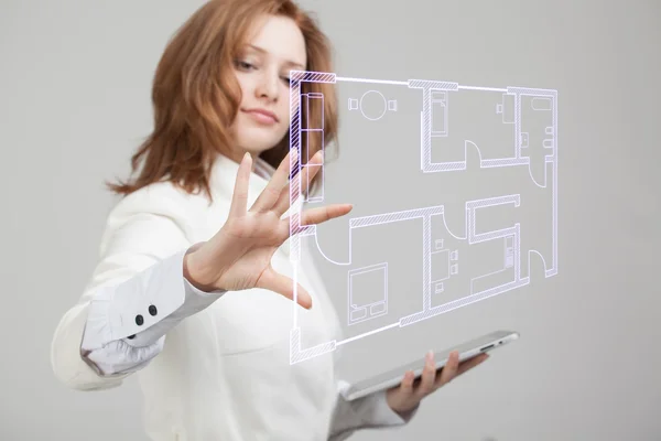 Female architect working with a virtual apartment plan — Stock Photo, Image