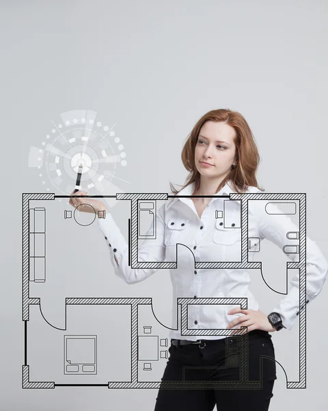 Female architect working with a virtual apartment plan — Stock Photo, Image