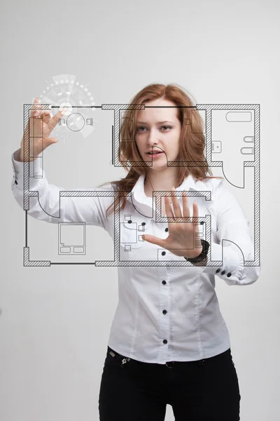 Female architect working with a virtual apartment plan — Stock Photo, Image