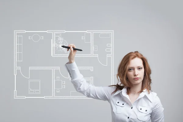 Female architect working with a virtual apartment plan — Stock Photo, Image