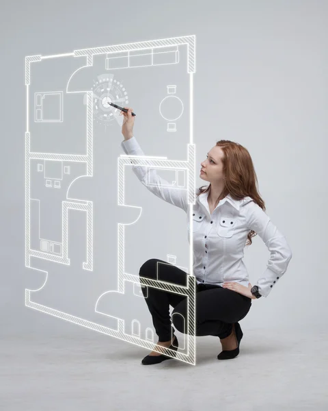 Female architect working with a virtual apartment plan — Stock Photo, Image