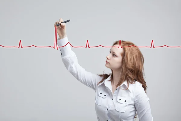 Doctor woman drawing cardiogram — Stock Photo, Image