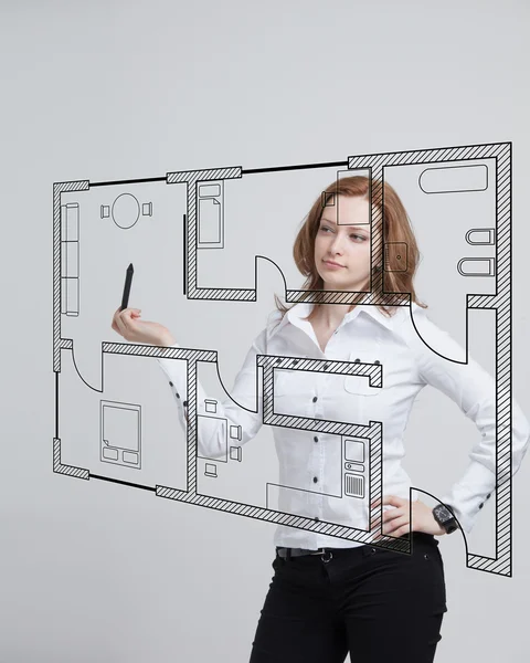 Female architect working with a virtual apartment plan — Stock Photo, Image