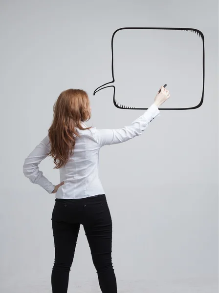 Woman writes in a painted  speech cloud — Stock Photo, Image