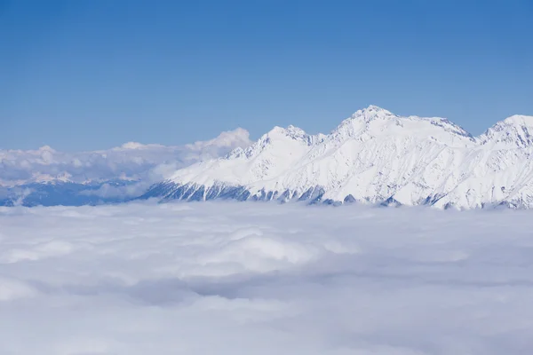 View on mountains and blue sky above clouds, Krasnaya Polyana, Sochi, Russia — Stock Photo, Image