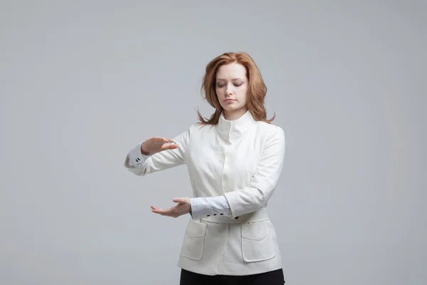Woman holding something in hands — Stock Photo, Image