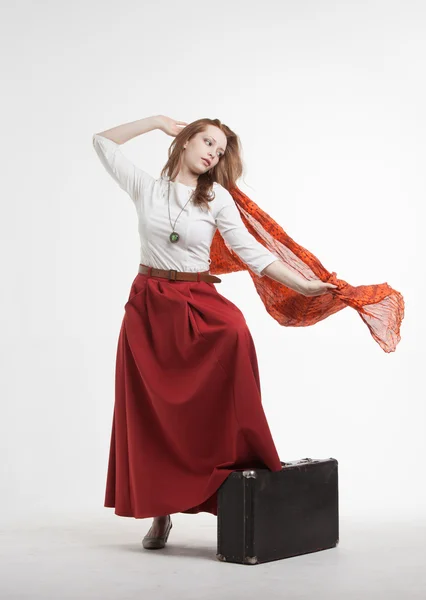 Woman in skirt dancing with a red handkerchief — Stock Photo, Image