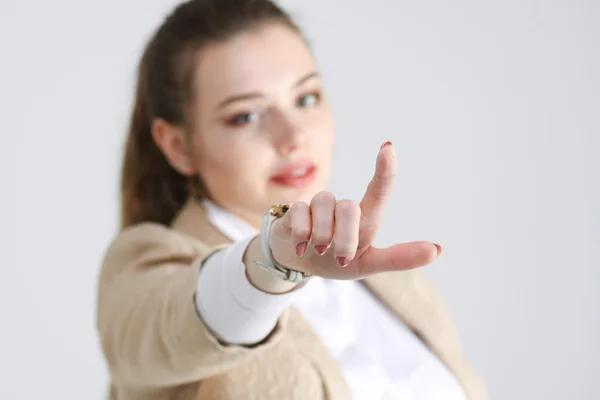 Woman presses a virtual button — Stock Photo, Image