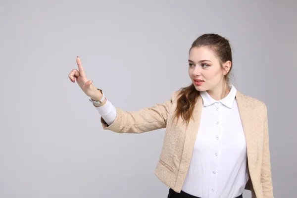 Woman presses a virtual button — Stock Photo, Image