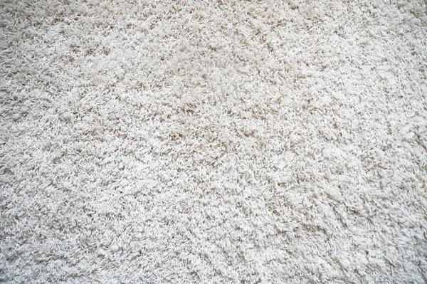 White carpet background with long pile