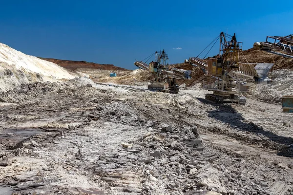Rotary crawler excavator is mining sand in a clay quarry. Zaporozhye region, Ukraine. March 2015
