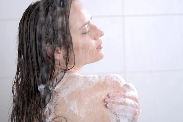 Woman washing her body shower gel Stock Picture