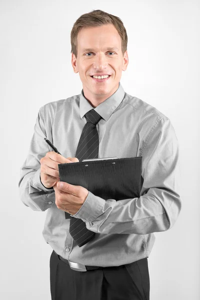 Business man with clipboard — Stock Photo, Image