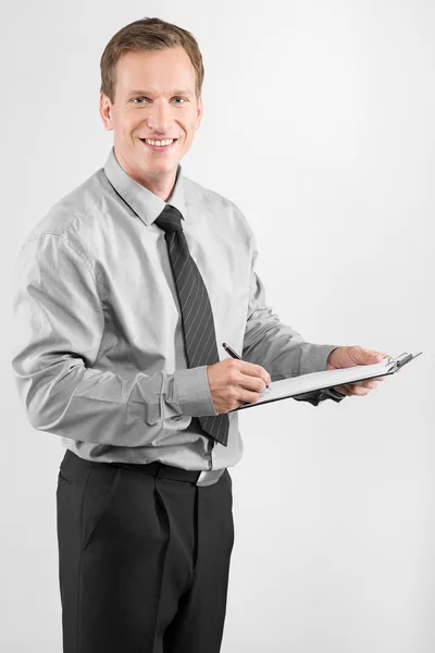 Business man with clipboard — Stock Photo, Image