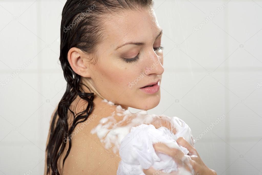 woman washing her body shower gel