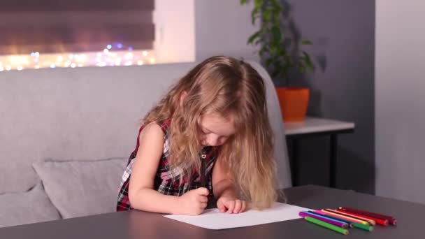 Charming little blonde girl in red checkered dress painting with colorful pencils. childhood, toddler, daughter. FullHD footage — Vídeos de Stock
