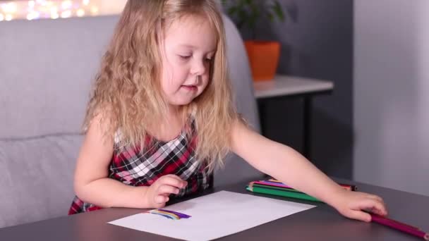 Charming little blonde girl in red checkered dress painting with colorful pencils. childhood, toddler, daughter. FullHD footage — Stock Video