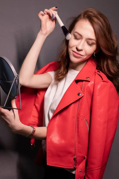Charming Brunette Woman Red Leather Jacket Makeup Brushes Isolated Grey — Stock Photo, Image