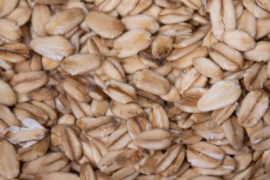 Makro yulaf ezmesi dokusu. Yulaf ezmesi yemek arkaplanı. Sağlıklı kahvaltı konsepti. Müsli gevrekleri