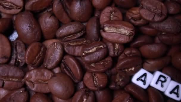 Sliding Roasted Coffee Beans Word Arabica Written Little White Cubes — Stock Video
