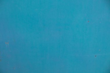 Boya katmanlı eski mavi bir duvar. Arka plandaki doku. Tuval üzerine yağlı boya. kopyalama alanı. Tasarım için pankart.