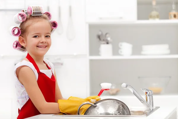 Little houskeeping girl Stock Photo