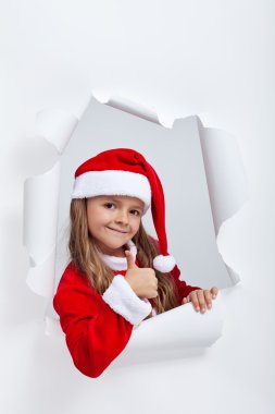 Noel Baba kıyafeti thums tabela veren küçük kız