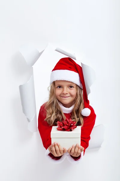 Happy little girl with christmas present — Stock Photo, Image