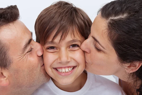 Happy boy having the attention of his parents Stock Photo