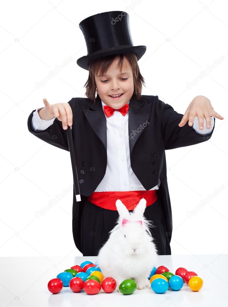 Young magician boy performing an easter trick