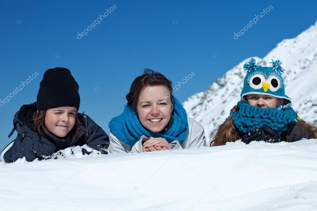 Happy family in the snow - portrait