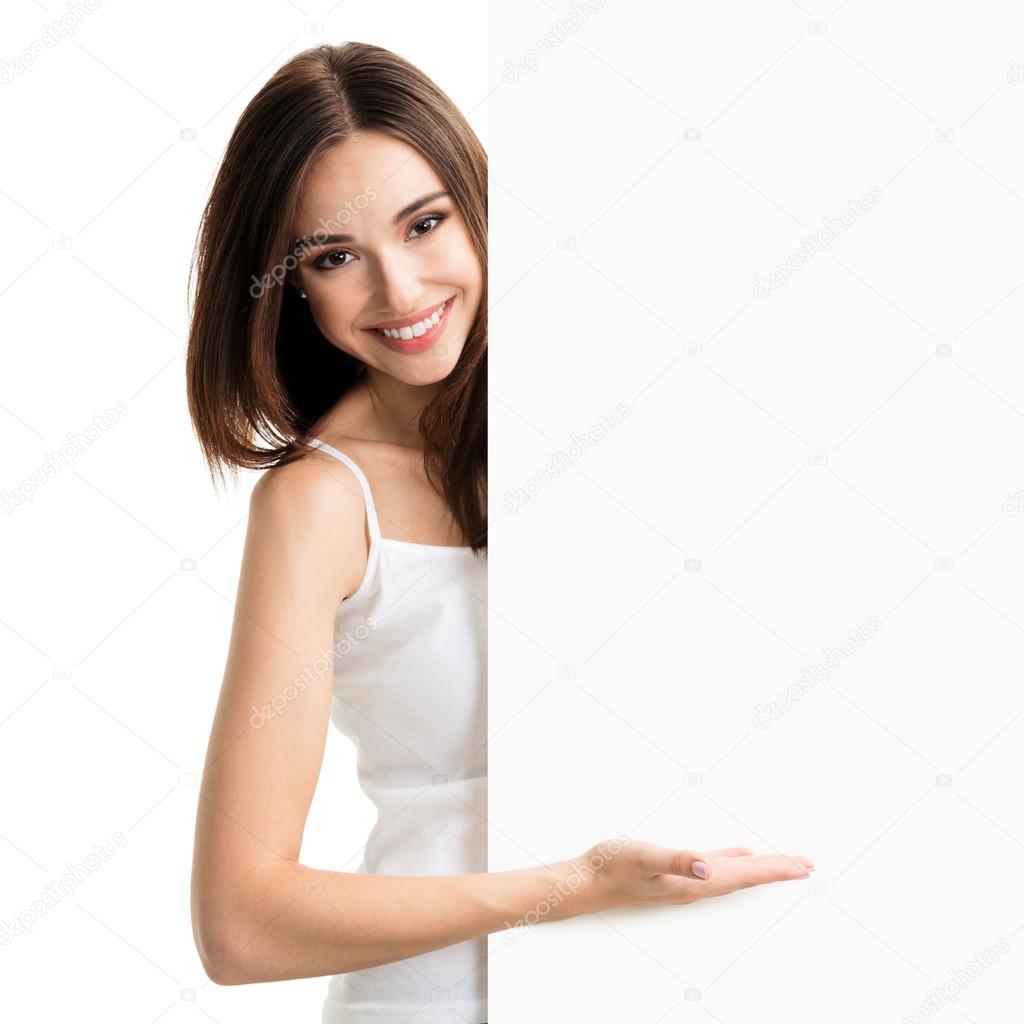 Brunette woman in casual clothing showing blank signboard