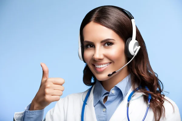 Young doctor in headset, showing thumb up — Stock Photo, Image