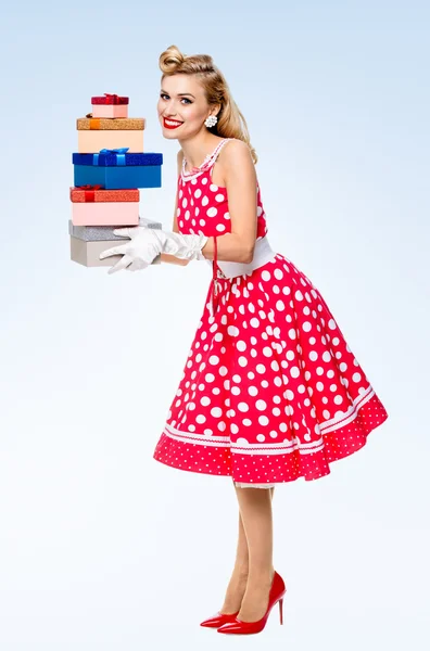 Full body of woman in pin-up style red dress with gift boxes — Stock Photo, Image