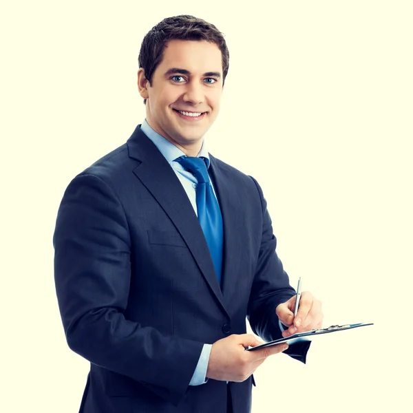 Happy smiling businessman with clipboard writing — Stock Photo, Image