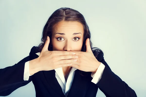 Business woman covering mouth — Stock Photo, Image