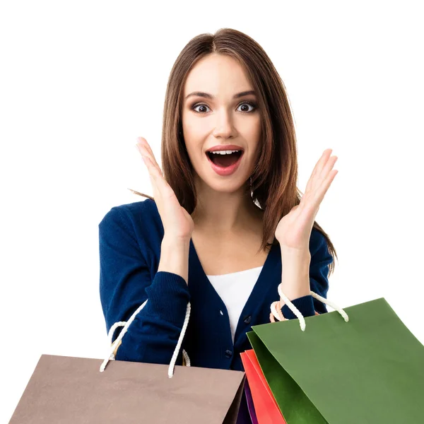 Hermosa mujer en ropa casual con bolsas de compras, en blanco —  Fotos de Stock