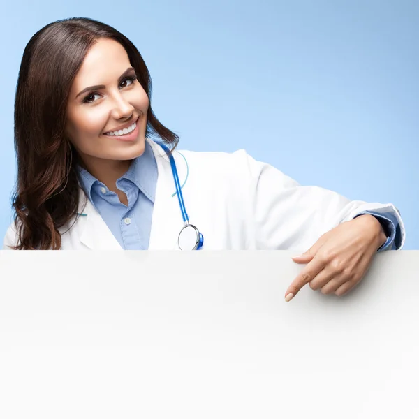 Doctor showing blank signboard with copyspace — Stock Photo, Image