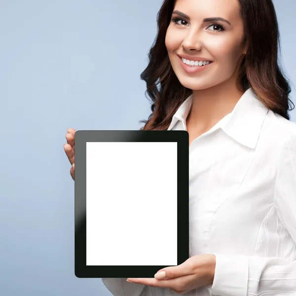 Businesswoman showing blank tablet pc, on grey — Stock Photo, Image